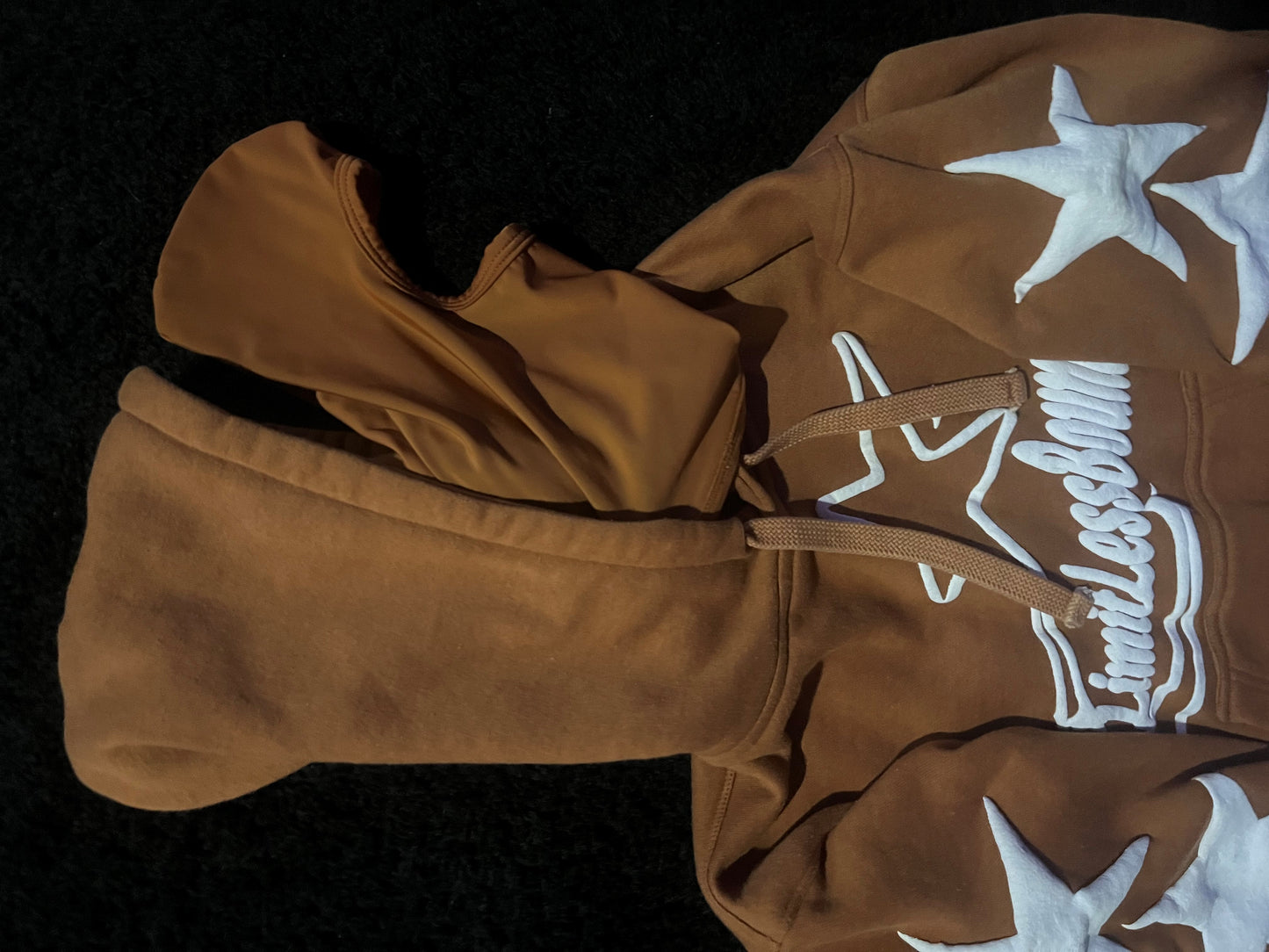 brown and white mask hoodie