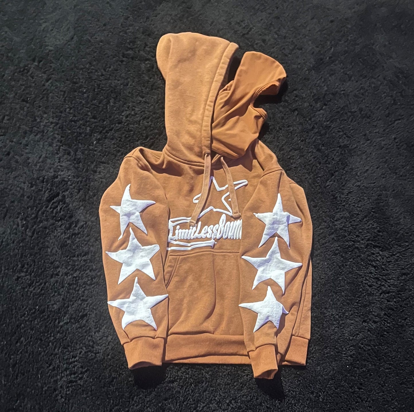 brown and white mask hoodie